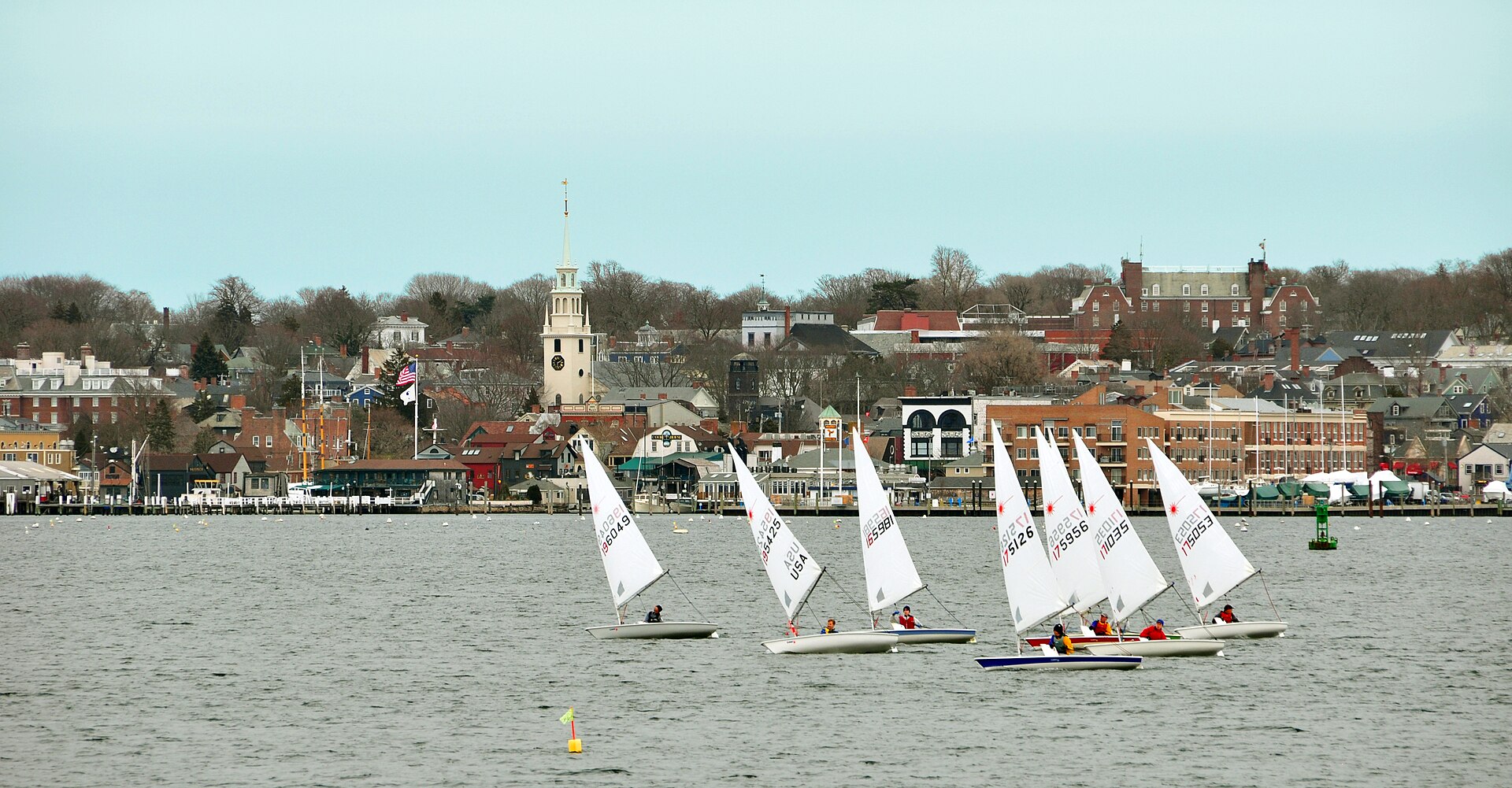 Sailboats and local marine activity in Newport Harbor